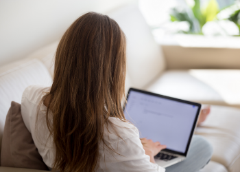 Woman typing on laptop