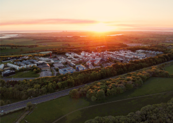 Aerial view of a rural college campus at sunset.