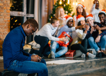 Man self-isolating at holiday party.