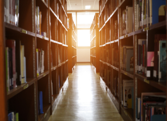 the aisle of a university library stack