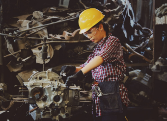 Woman working in automotive factory