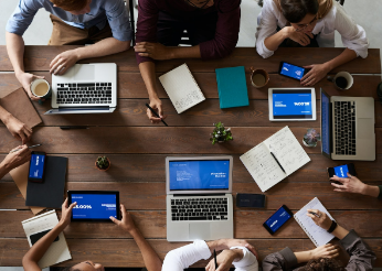 Aerial view of work team collaborating at table