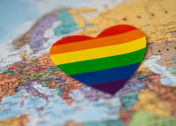 Rainbow heart on world map