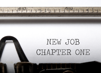 Typewriter paper reading 'New Job Chapter One'