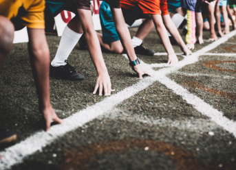 Close-up of runners lined up to start a race
