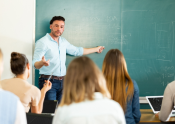 Male teacher presenting in college class