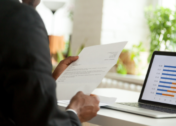 Man reading a cover letter