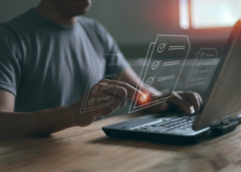 Man at laptop with virtual checklists