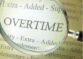 The word 'overtime' under a magnifying glass