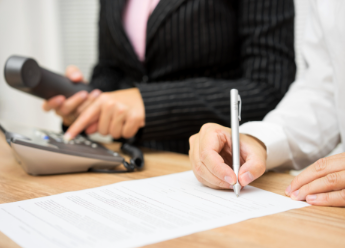 Close-up of employers checking references and making phone call