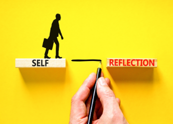 Illustration of man walking on 'self-reflection' word blocks