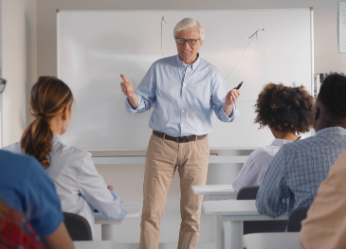 Senior professor teaching in a classroom of students