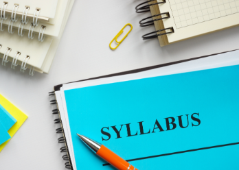 Syllabus on desk among notebooks
