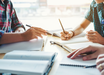 Close up of students studying/tutoring