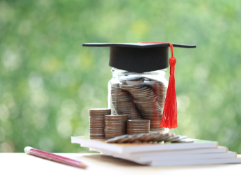 Jar of coins with grad cap on it