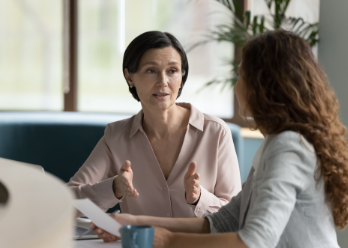 Woman mentoring a female coworker
