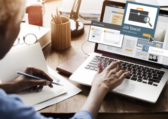 Woman searching for a job on laptop